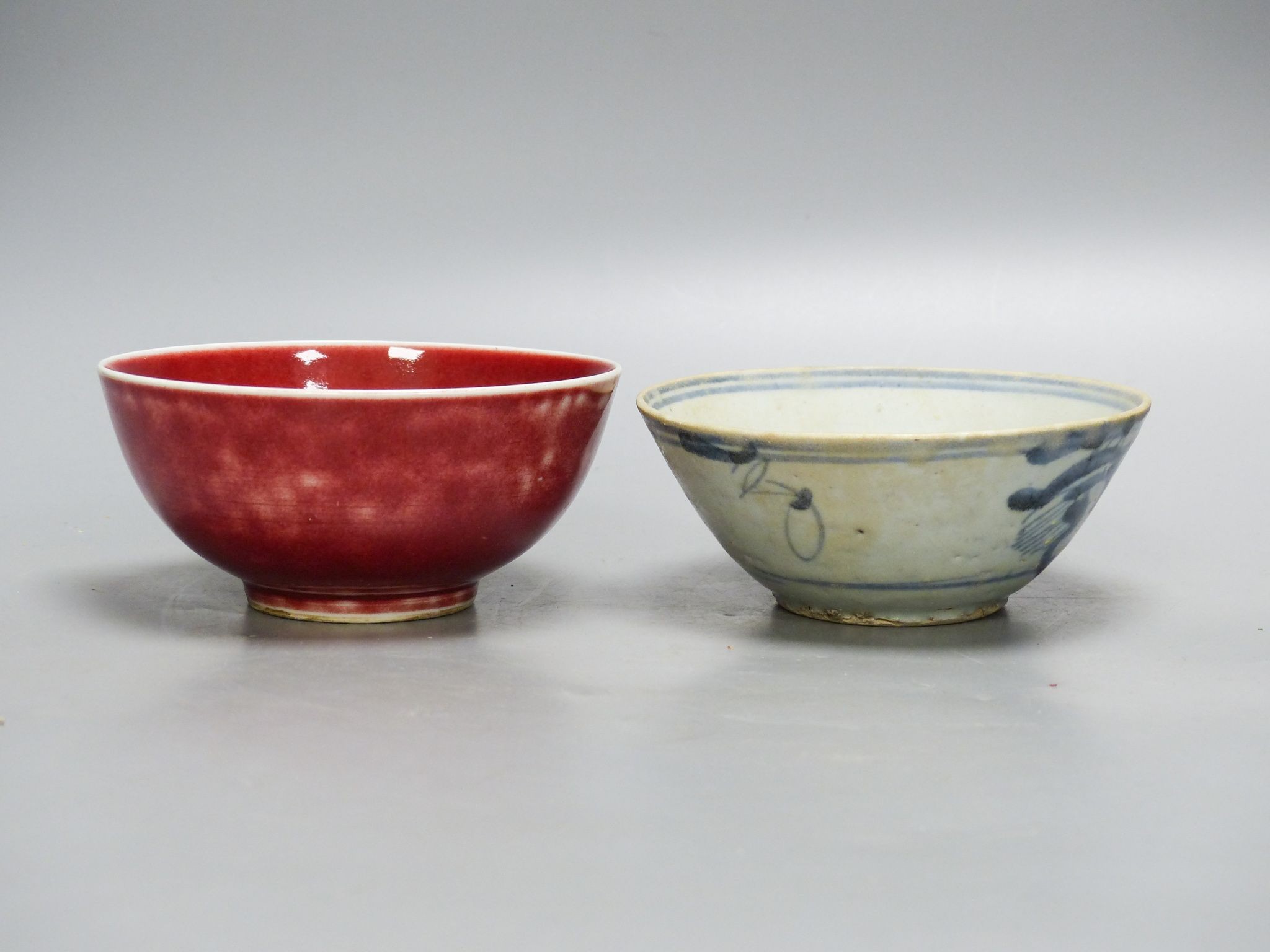 A Chinese sang de boeuf bowl and a blue and white bowl, 12.7cm